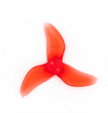 A translucent red three-blade FPV drone propeller on a solid white background.